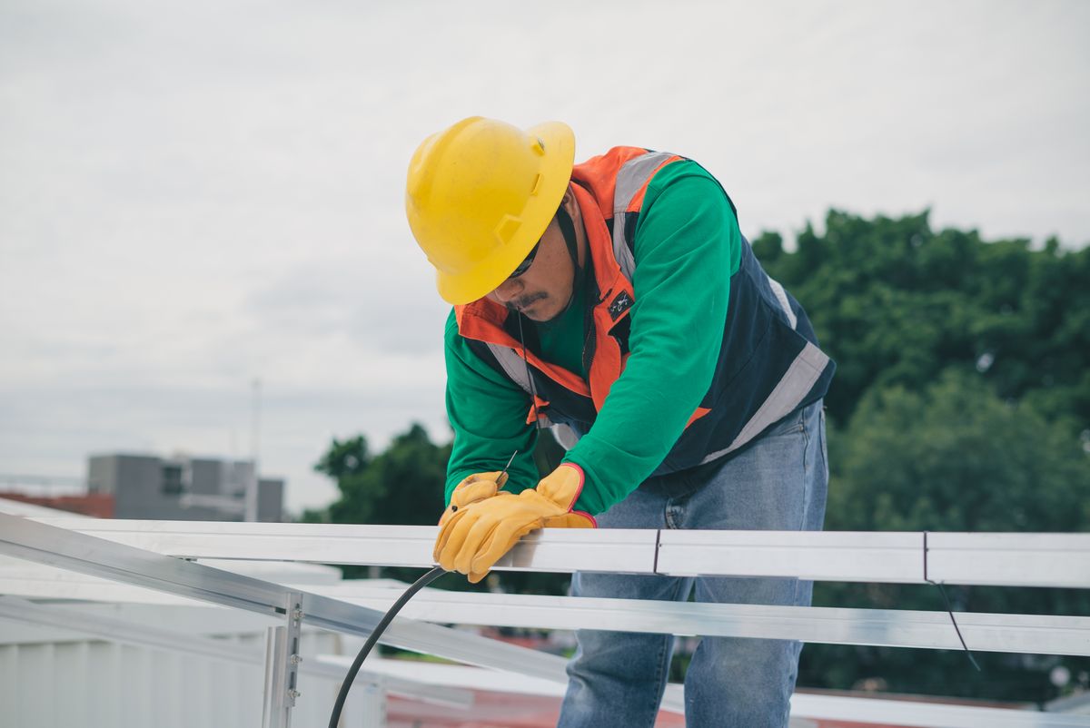 Roofing technician working on a home after winning the job through strong reviews and a fast callback