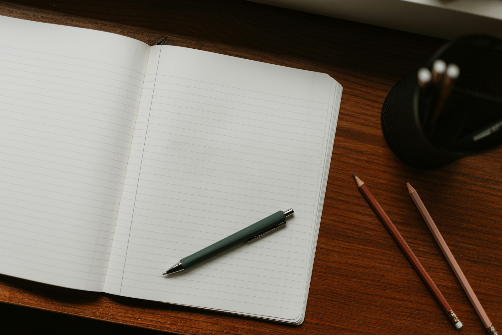 Open notebook on a desk used for planning the first 90 days of marketing a new service business